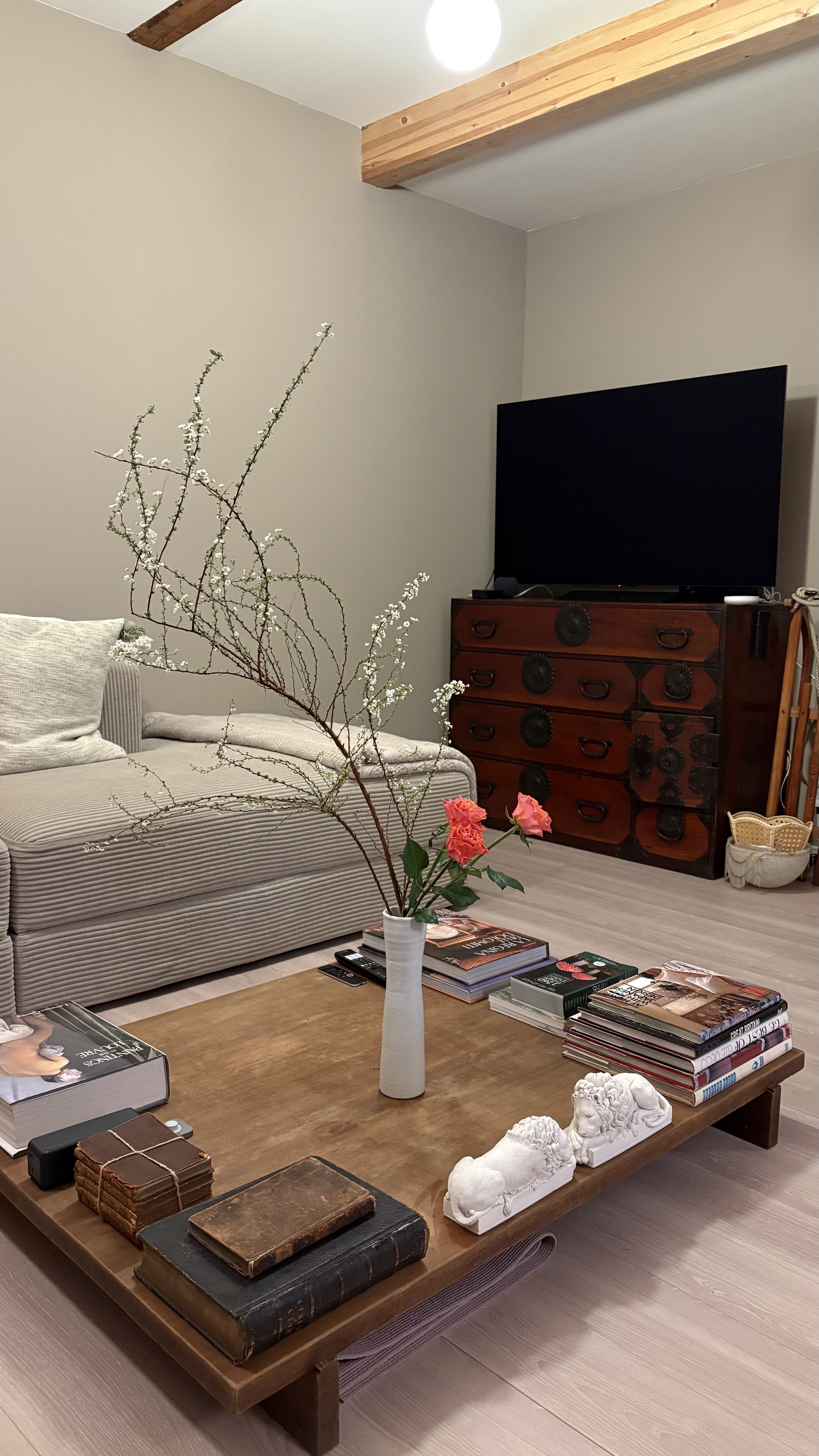 Traditional coffee table with flower arrangement and antique books